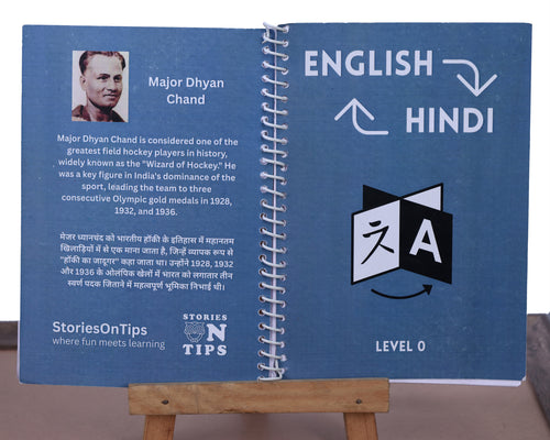 Open book with English to Hindi translation on a stand